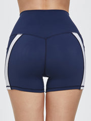 Dark blue activewear shorts with white side stripes and a high waist.