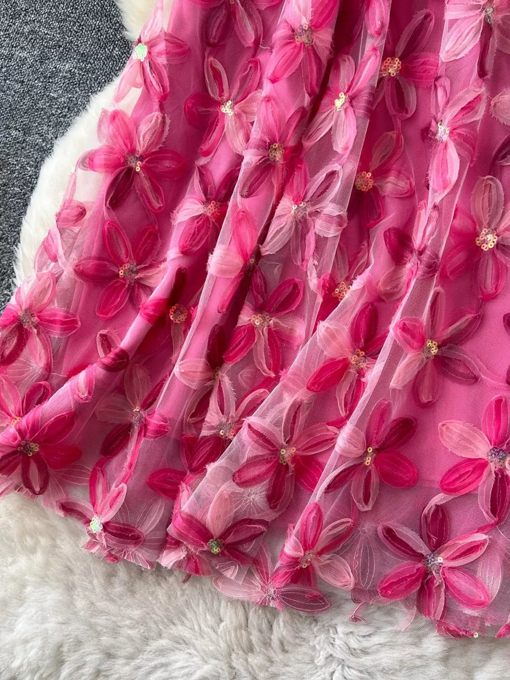 Embroidered floral layered skirt in pink with sequin details.