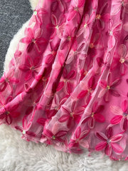 Embroidered floral layered skirt in pink with sequin details.
