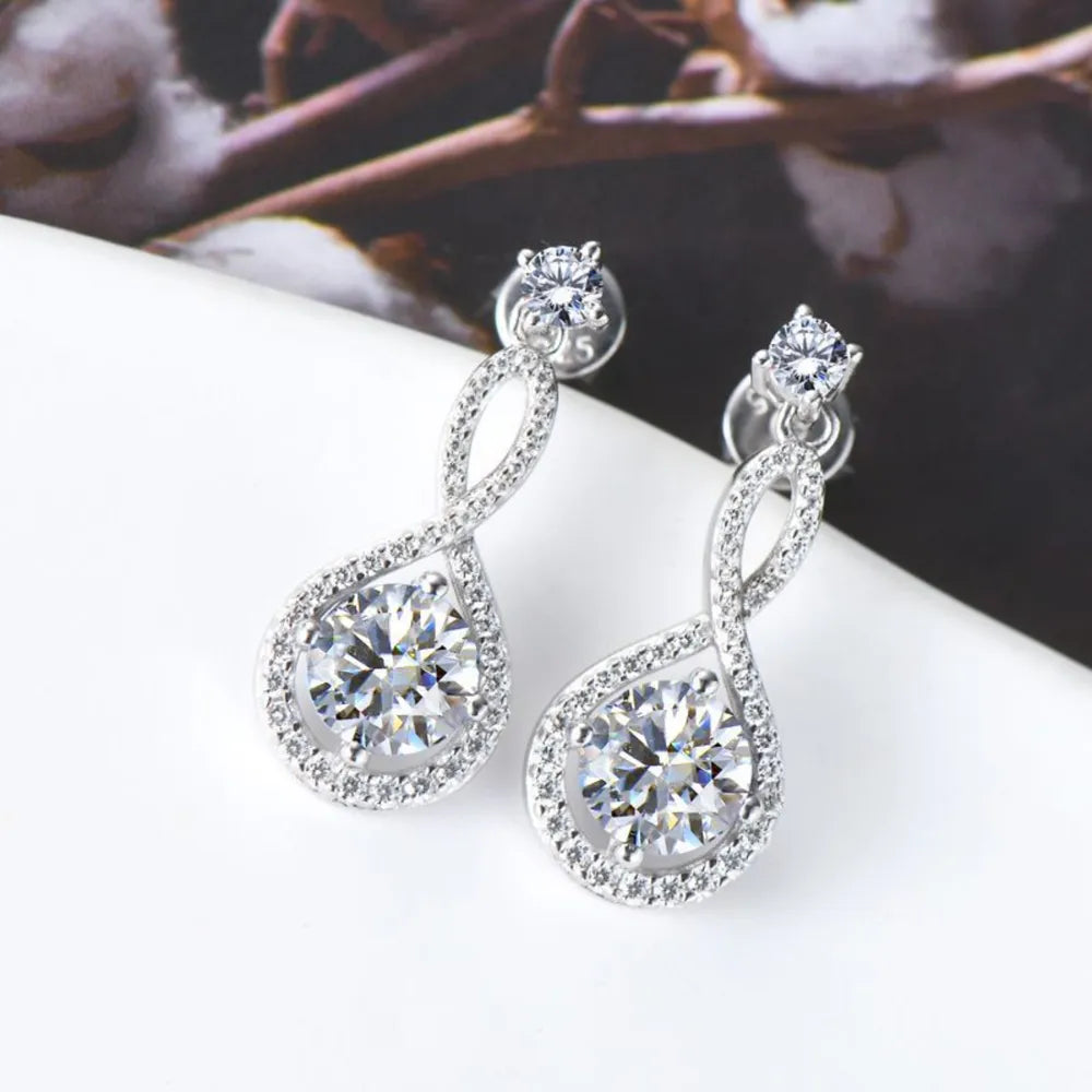 Infinity drop earrings with clear stones and silver setting.