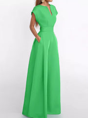 Chic neon green wide-leg romper with V-neck, cap sleeves, and pockets.