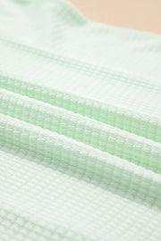 Relaxed V-neck waffle knit t-shirt in light green fabric detail