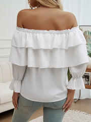 White tiered ruffle off-shoulder blouse with ruffled cuffs and tie detail