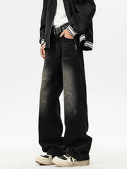 Distressed black wide leg jeans with a faded wash and ripped details.