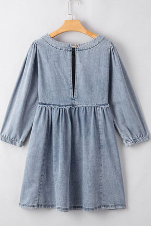 Gathered waist denim mini dress in medium wash with balloon sleeves and a keyhole back detail.