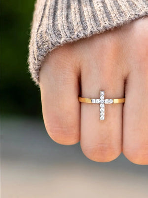 Gold band ring with a pavé crystal cross detail.