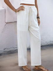 White linen-blend wide-leg trousers with drawstring waist and pockets