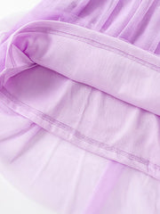 Toddler lilac embroidered floral tulle dress detail showing layered fabric and stitching.