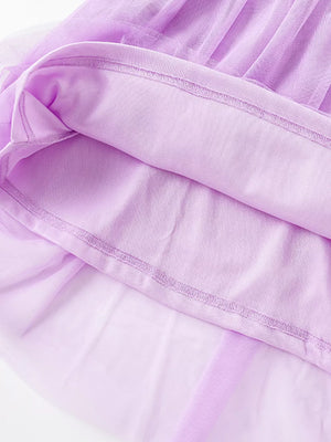 Toddler lilac embroidered floral tulle dress detail showing layered fabric and stitching.