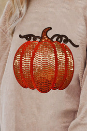 Relaxed fit corduroy sweatshirt in eggshell with a sequin pumpkin detail.