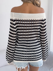 Off-shoulder striped mesh knit sweater with eyelet details and a cream neckline.