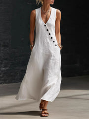 White asymmetrical button-down midi dress with V-neck and sleeveless design.