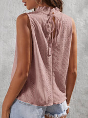 Dusty pink eyelet tank top with ruffled neckline and back tie detail.
