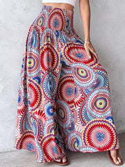 Bohemian print smocked waist wide leg pants in a multicolor mandala pattern.