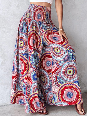 Bohemian print smocked waist wide leg pants in a multicolor mandala pattern.