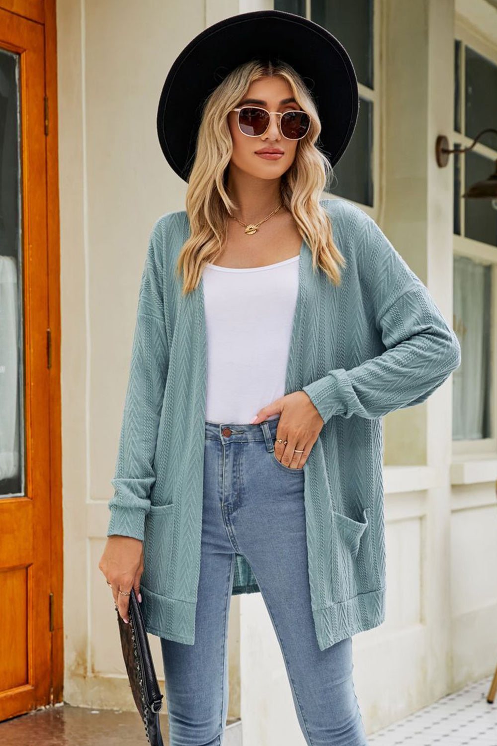 Air Force Blue cardigan with pockets and chevron pattern.