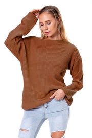 Off-shoulder waffle knit sweater in chestnut acrylic with a relaxed fit.