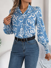 Light blue floral print blouse with shirred cuffs and buttoned front.
