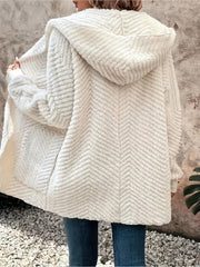 Ivory textured chevron hooded cocoon coat with a cozy, casual fit.