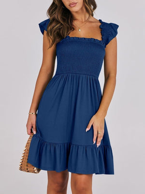 Navy smocked mini dress with ruffle hem and square neckline.