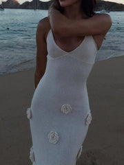 White cami gown with embroidered rose appliqués and a V-neckline.