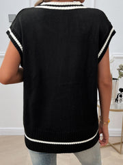 Black acrylic cable knit vest with white stripe trim on neckline, armholes, and hem.