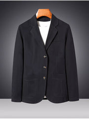 Black cotton lapel blazer for men with buttoned front and patch pockets.
