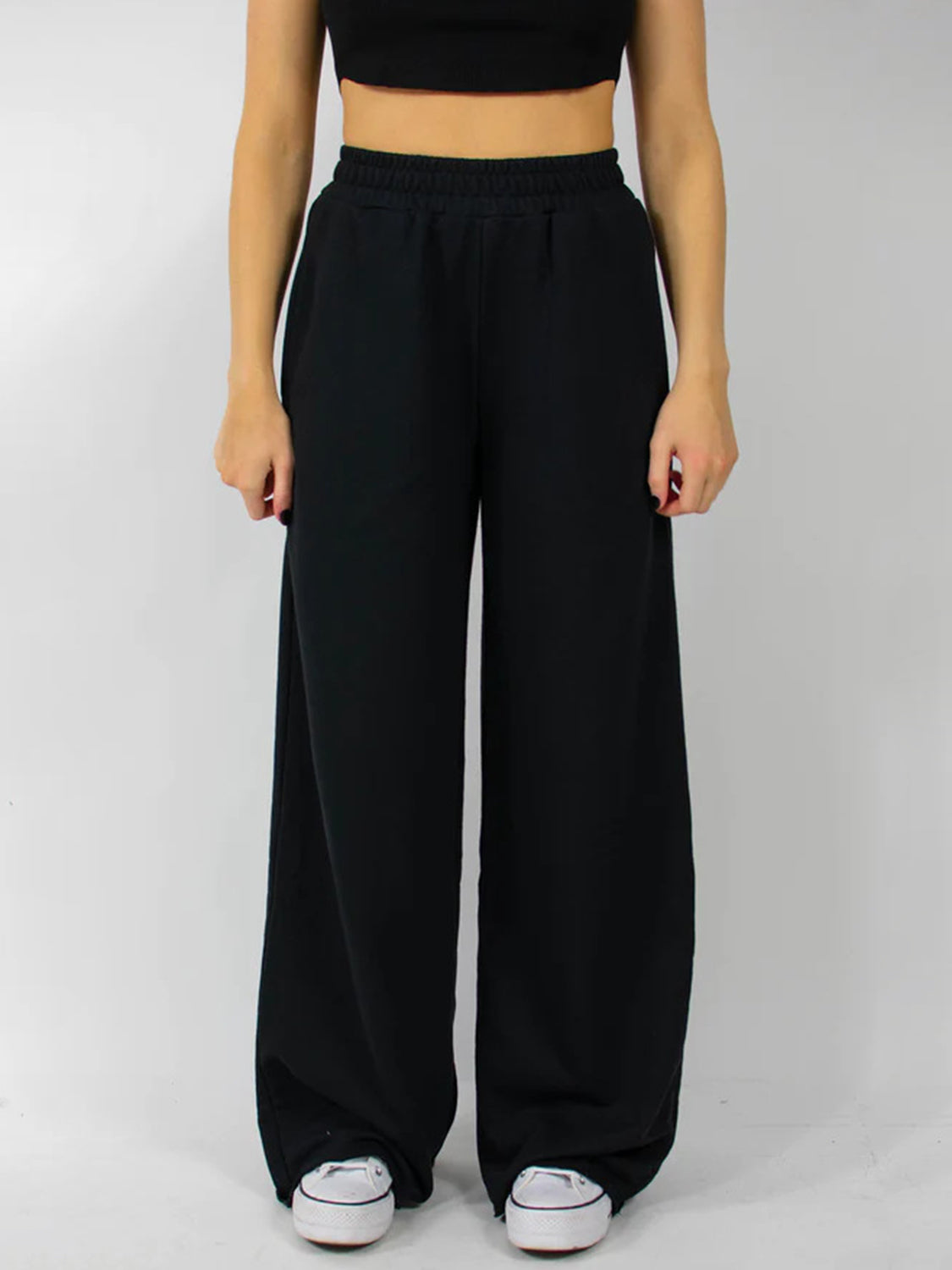 Black wide-leg lounge pants with elastic waistband and pockets