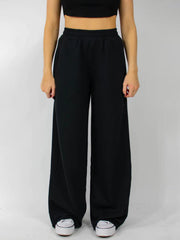 Black wide-leg lounge pants with elastic waistband and pockets