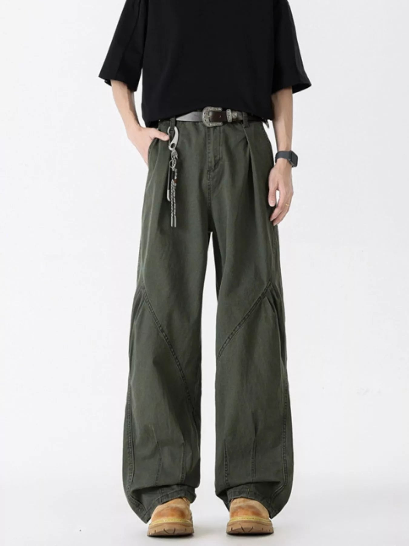 Men's oversized wide-leg jeans in green, 100% cotton, with unique paneling and a relaxed fit.