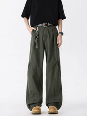 Men's oversized wide-leg jeans in green, 100% cotton, with unique paneling and a relaxed fit.