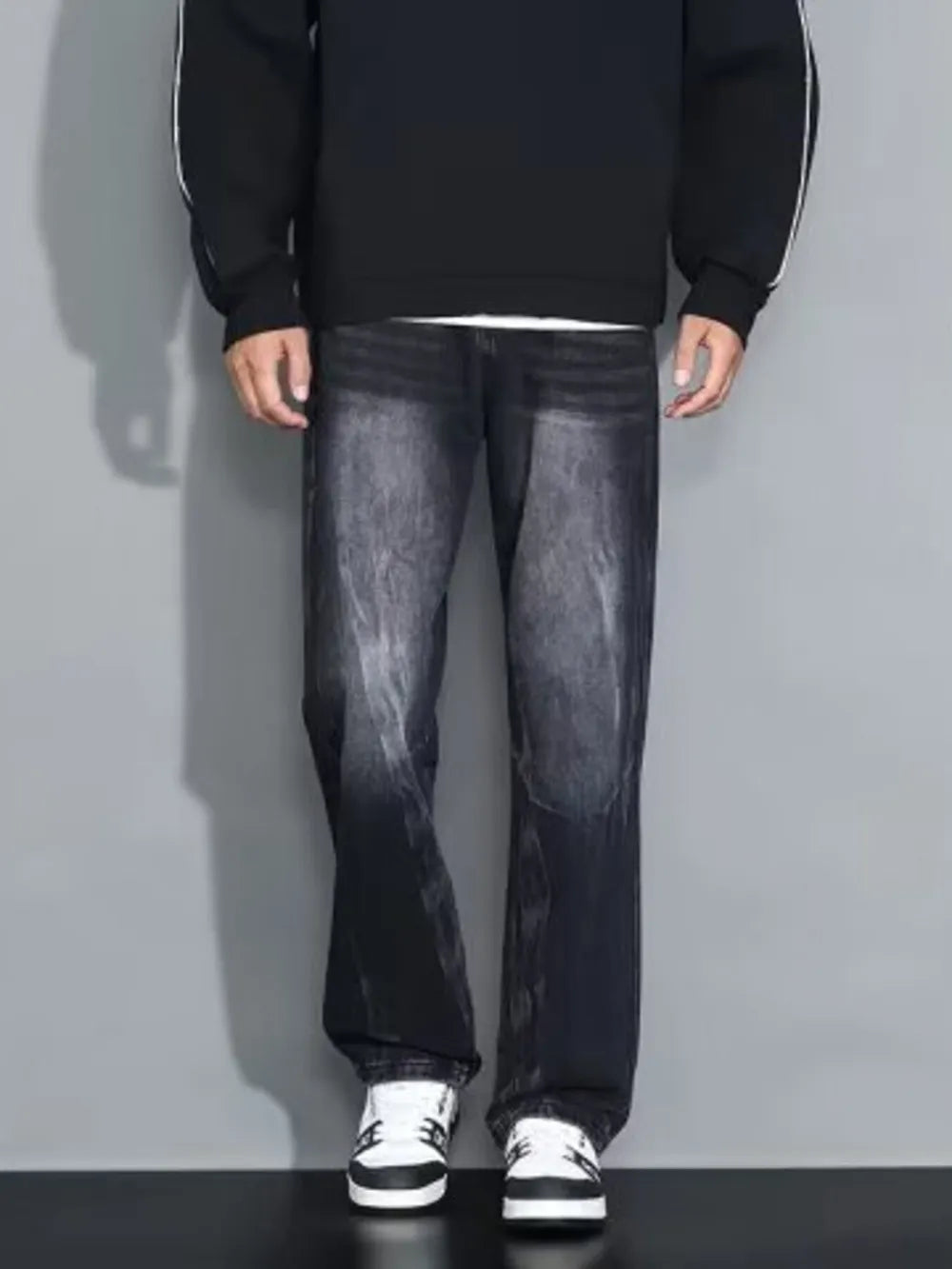 Men's dark wash loose-fit jeans with a faded effect and straight leg cut.