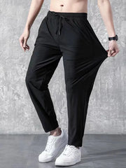 Black relaxed-fit drawstring trousers with elastic waistband and adjustable tie.