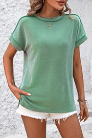 Green vertical ribbed tunic tee with split hem and short sleeves.