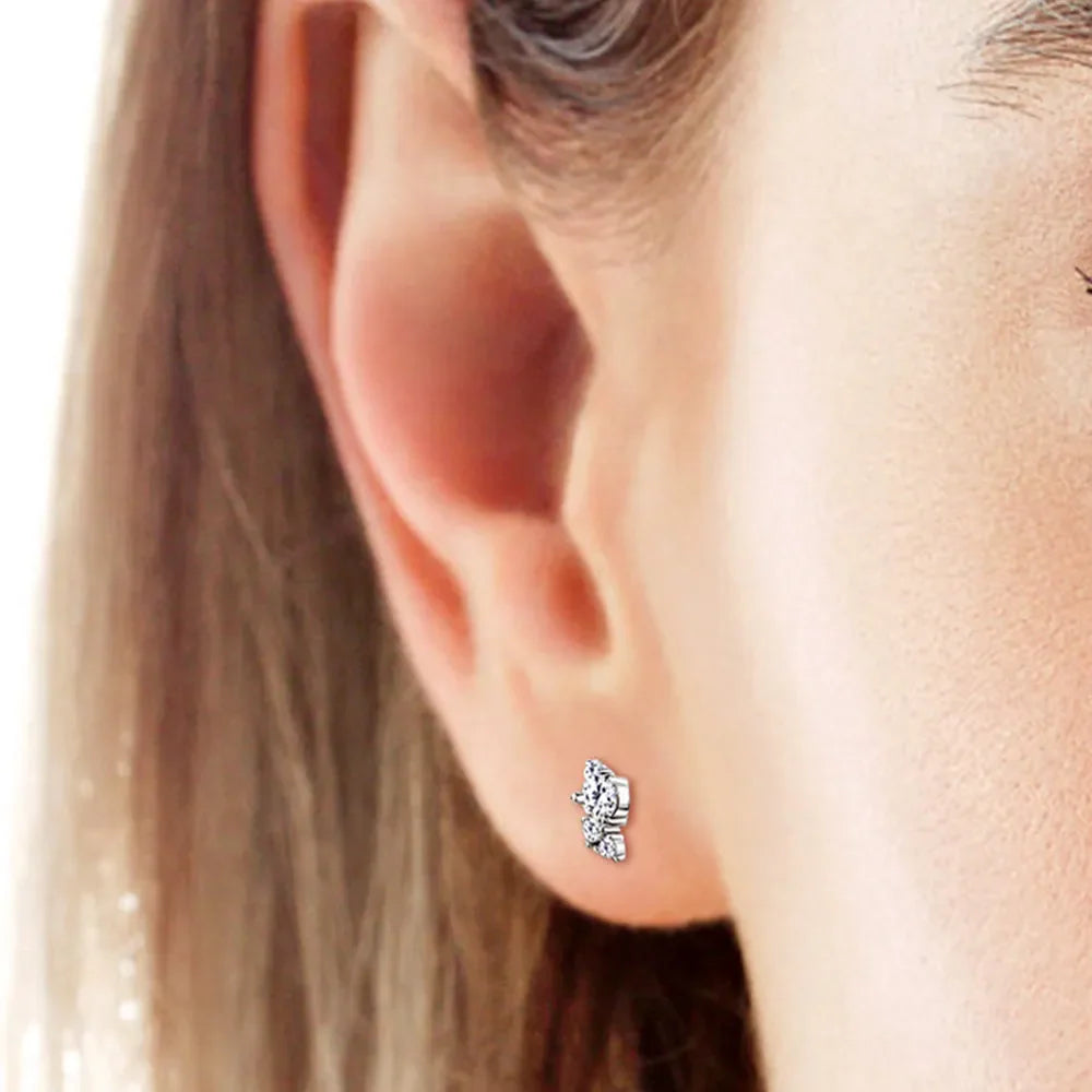 Silver diamond stud earrings with celestial cluster design