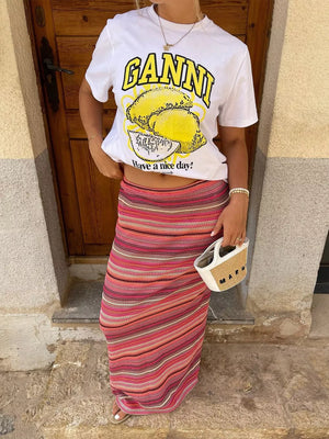 Vibrant striped full-length knit skirt with a body-skimming fit in pinks and reds.