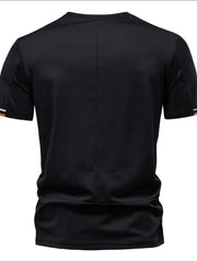 Black t-shirt with embroidered crest detail on sleeve cuff and subtle back seam.