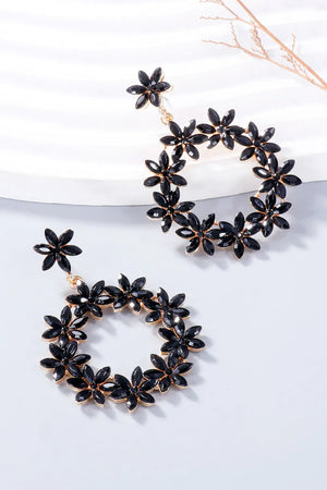 Black floral halo drop earrings with gold alloy accents.