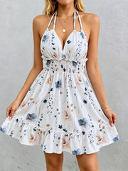White floral print halter neck mini dress with smocked waist and ruffled hem.