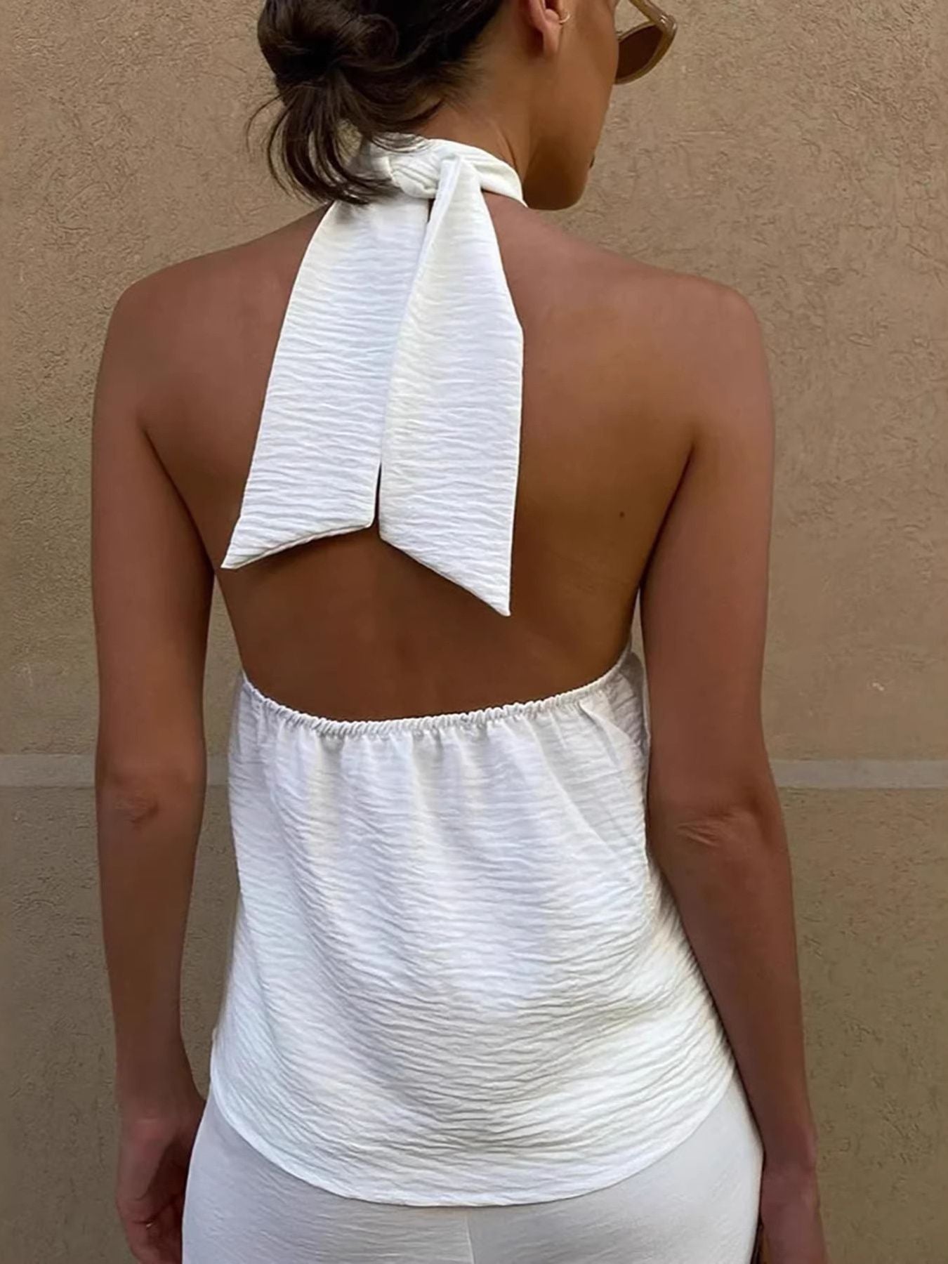 White textured backless halter cami with tie detail and elasticated neckline