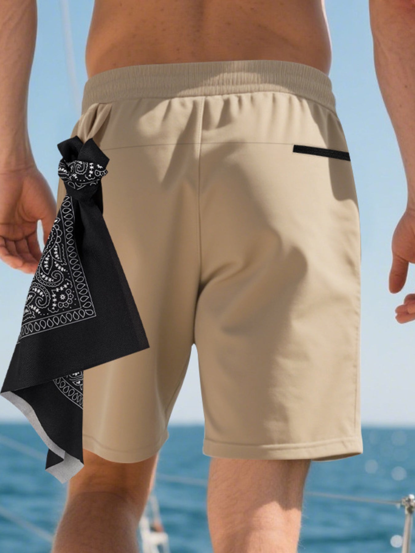 Khaki chino shorts with drawstring waist and black back pocket detail.