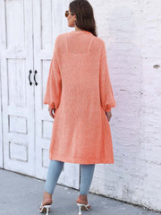 Ribbed knit maxi cardigan in Sherbet with long sleeves and pockets.