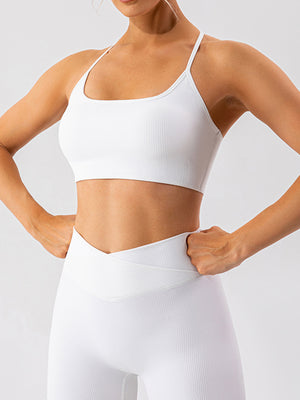 White ribbed halterneck active bra with thin straps and a square neckline.