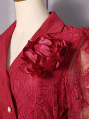 Red lace midi dress with a large floral applique and button placket detail.