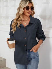 Dark Navy corduroy overshirt with patch pockets and button front, worn by a woman holding coffee.