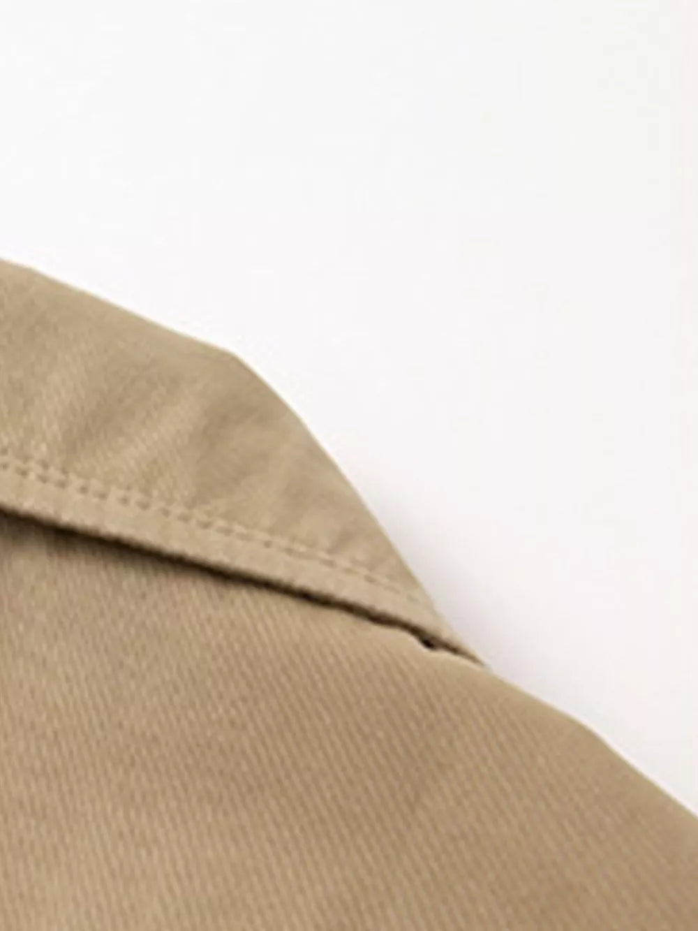 Khaki cotton lapel blazer detail with visible stitching.