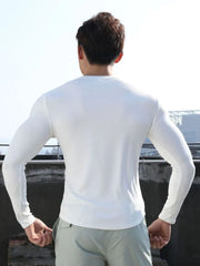 White ribbed long sleeve t-shirt with a V-neck and a sculpted fit.
