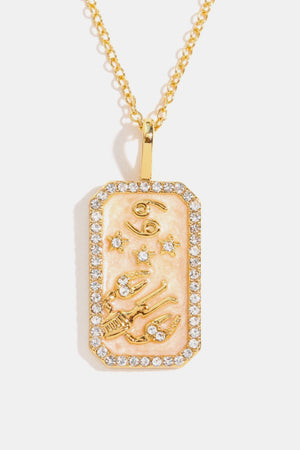 14K gold-plated Cancer zodiac sign pendant necklace with crystal border and peach enamel.
