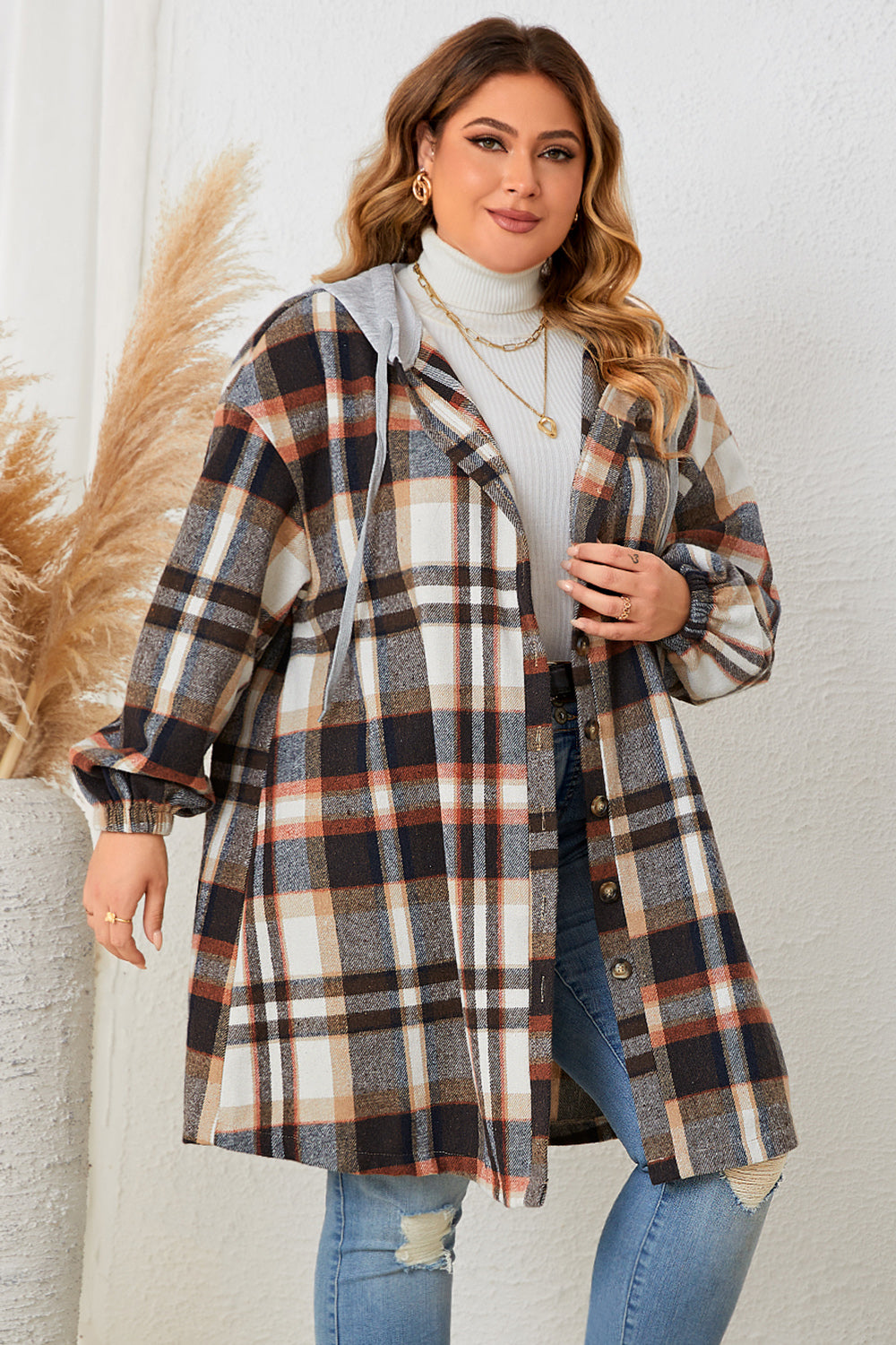Plaid hooded shacket in black with balloon sleeves and button front.