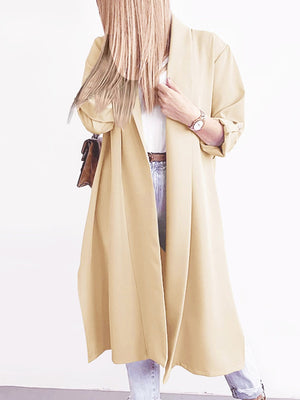Pastel yellow draped-front maxi trench coat with button cuffs and a relaxed fit.